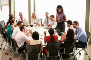 An employee addresses a board meeting.