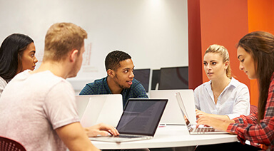 graduate students having a discussion