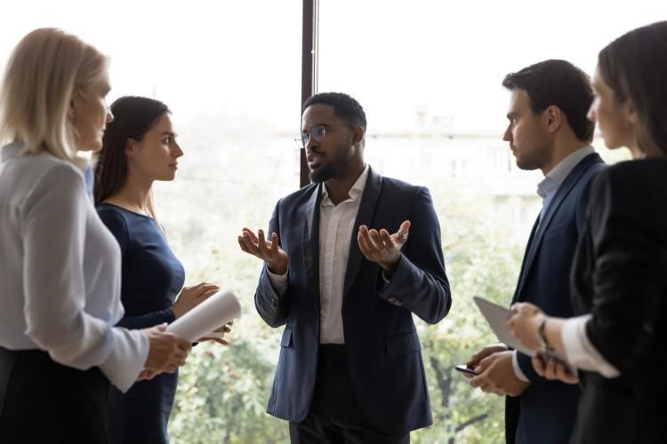 A manager talks with a team.