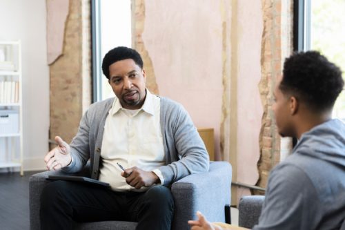 A counselor talks with a client.