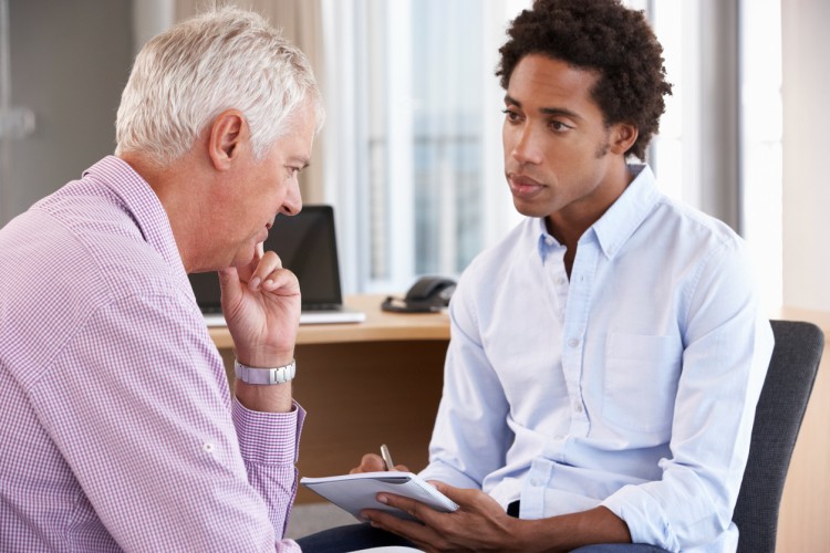 A social and human service assistant meets with a client