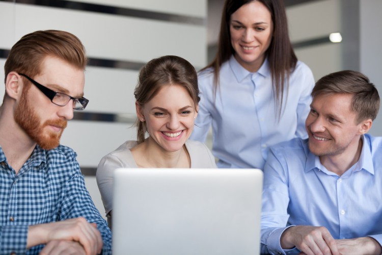 A media planner reviews content with her team.