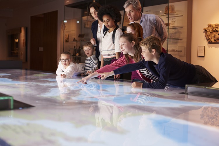 A history teacher takes his class to a museum.